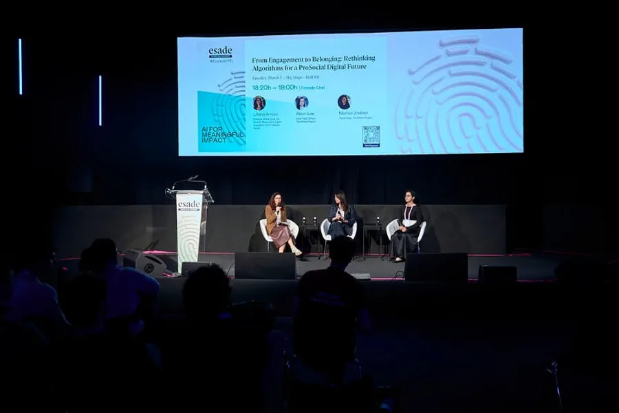 A fireside chat on the Sky Stage at Mobile World Congress: three speakers seated beneath a screen reading From Engagement to Belonging: Rethinking Algorithms for a ProSocial Digital Future.